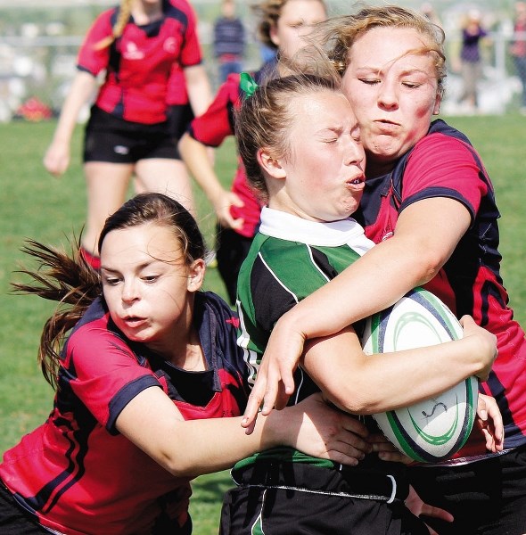 Springbank Phoenix scrum half Kelly Melrose takes a shot in Big Sky Zone high school girl&#8217;s championship rugby play against Strathmore May 31 in Calgary.