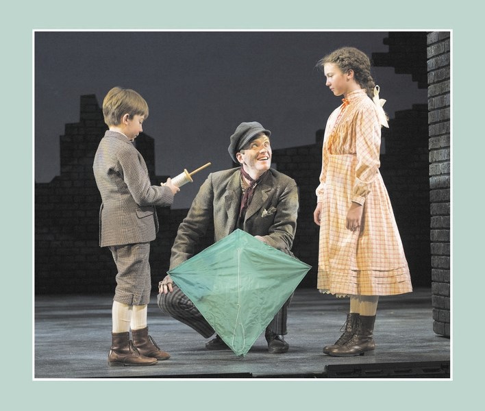 Bert (centre, played by Cochrane High alumnus Andrew MacDonald-Smith) discusses kite-flying with Michael and Jane Banks (played by Jack Forestier and Zasha Rabie) in Theatre