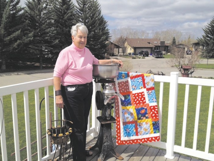 Kathleen &#8216;Kas&#8217; Beynon shows one of the many quilts she has made.