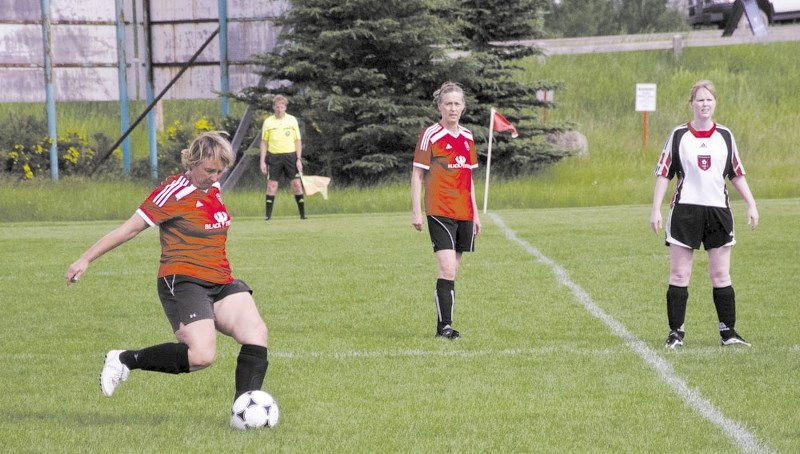 Sharon Birkett kicks the ball for the Cochrane Rangers during their 4-2 win against Chestermere United July 6 at Rangers Field.