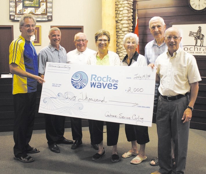 Cochrane Seniors Curling presented the &#8216;first of many&#8217; cheques to the Rock the Waves campaign for the proposed new aquatic/curling facility for $2,000. From left: 