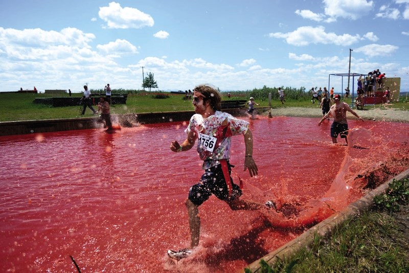 Connor Gray runs through a pool of &#8216;blood&#8217; at last year&#8217;s Zombie Survivor.