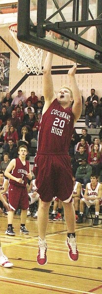 Connor Branch pounds the glass in Rocky View Sports Association senior boy&#8217;s division basketball final play March, 2012, in Airdrie. The 6-foot-9, Class of &#8217;12