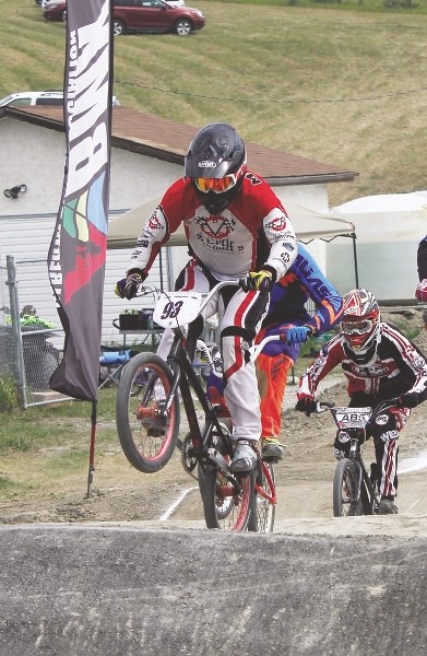 Cochrane&#8217;s Karsten Millman leads elite riders down the track at the Alberta Bicycle Motocross (BMX) Association provincial Race 5 at Cochrane BMX track July 19.