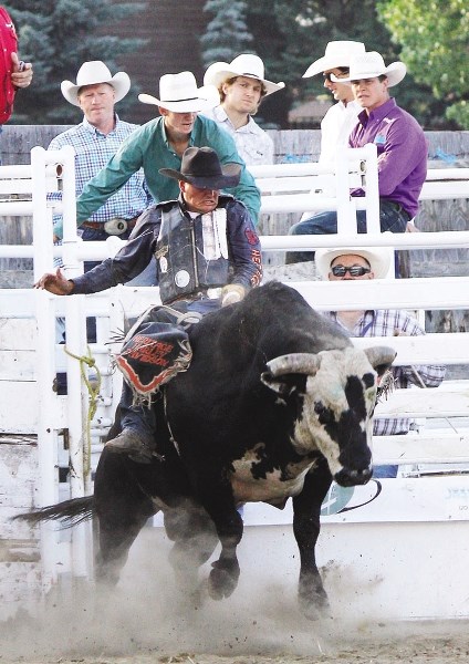 Cochrane&#8217;s Steven Turner takes Get Over It for a spin at the Cochrane Classic bull riding event July 26 at Cochrane Lions Rodeo Grounds. Turner got thrown at the