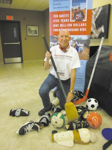 Martin Parnell getting ready to hit the road for “;Canada Quest for Kids,”preparing for the game of Quidditch, broom in hand.