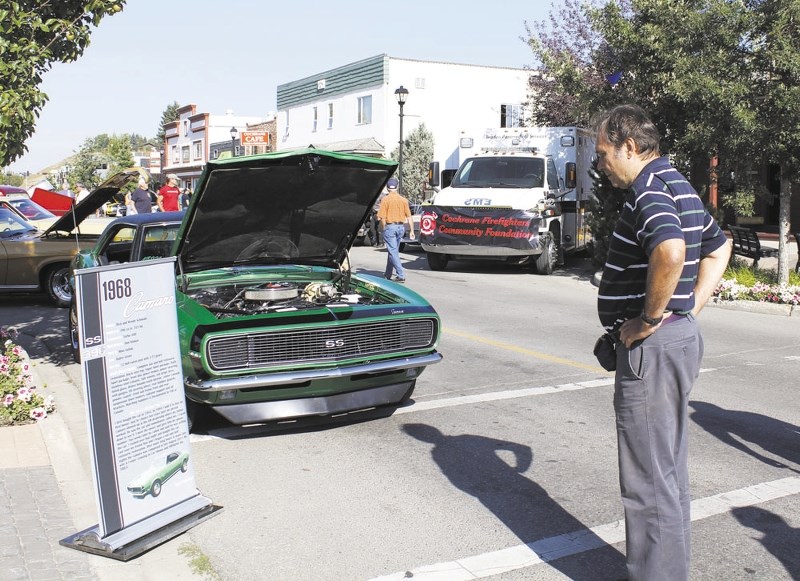 Rolf Stengl checks out the 1968 Camero at last year&#8217;s Cochrane Classic Car Show in downtown Cochrane.