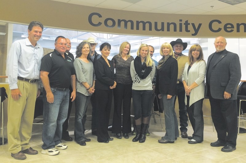 Banff-Cochrane MLA Ron Casey, far right, handed out $227,000 to five Cochrane organizations Sept. 8 at Cochrane Toyota.
