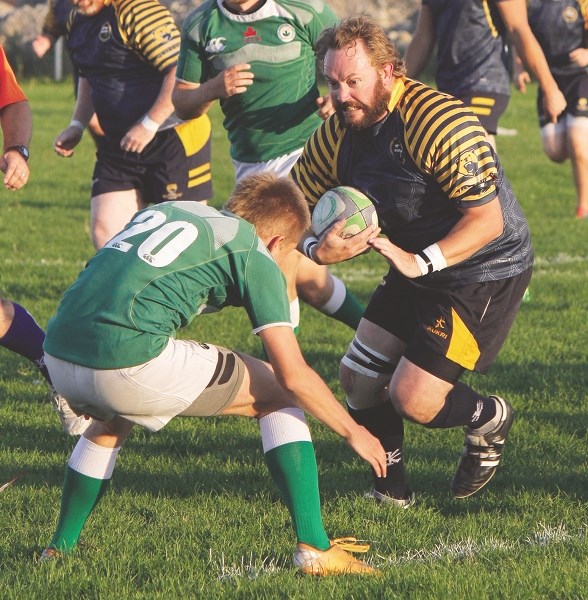 Bow Valley Grizzlies hooker Scott Megraw prepares to smash a Calgary Canadian Irish Athletic Club tackler in Calgary Rugby Union Div. 3 men&#8217;s play Sept. 5 in Calgary.