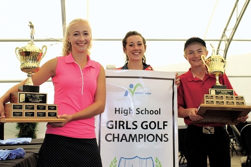 Cochrane High School Cobras (from left) Melanie Murchison, Bria Jansen and Max Murchison display the spoils for winning the Rocky View Sports Association&#8217;s senior