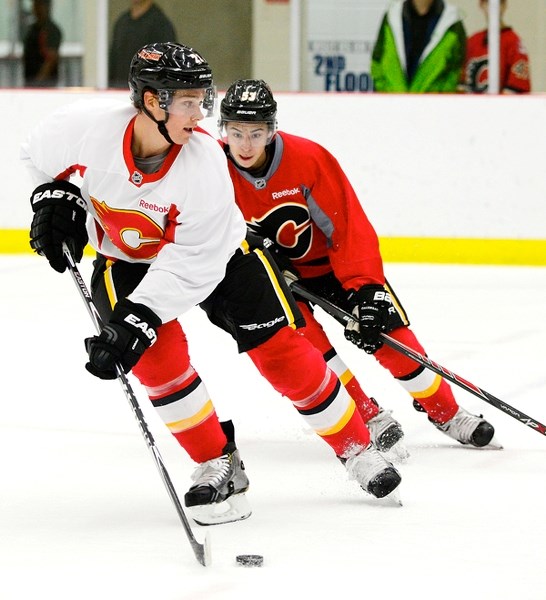 Cochrane&#8217;s Mason Raymond is chased by John Gaudreau during Calgary Flames first training-camp scrimmage Sept. 19 at WinSport&#8217;s Joan Snyder Arena.
