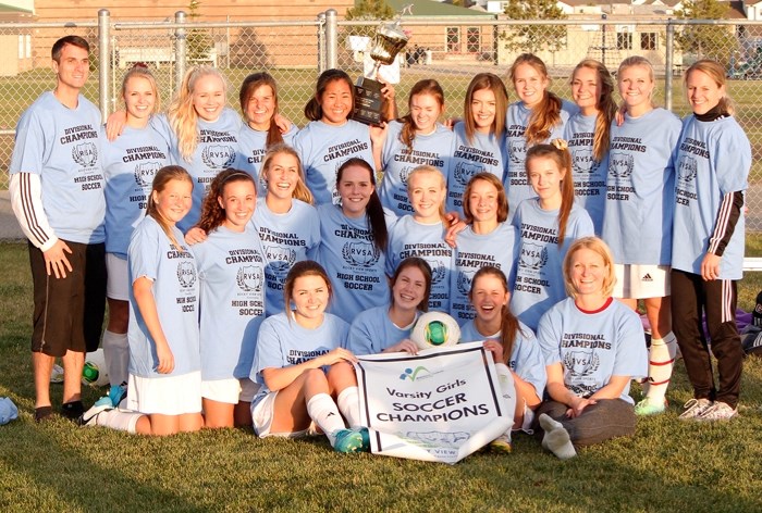 Cochrane High School Cobras display the spoils for winning the Rocky View Sports Association high school girl&#8217;s soccer championship Oct. 7 in Airdrie. The Cobras edged