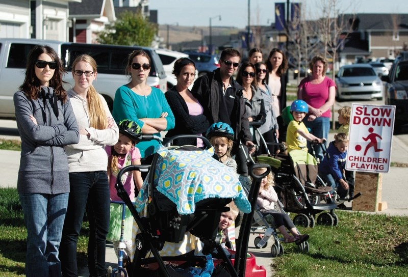 Riversong residents urge motorists to ease off the accelerator.