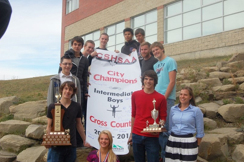 St. Timothy High School runners (clockwise from left) Noah Wttewall-Arteaga, Thomas Mackenzie, Kain Simmer, Graeme Murphy, Rory O&#8217;Donnell, Charles Cook, Alex Howells,