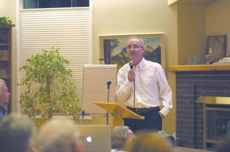 Neuroscientist Dr. Richard Wilson, PhD., resident of Springbank and co-founder of the Central Springbank Task Force for Sensible Development, presented at the town hall