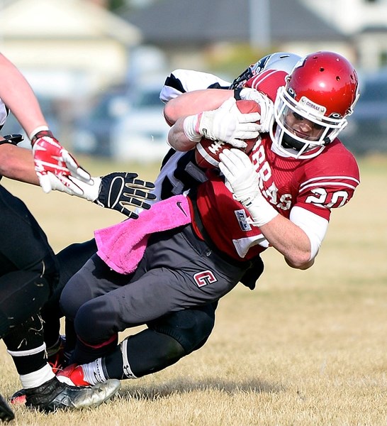 Cochrane Cobras slotback/tailback Tae Gordon takes a shot in Rocky View Sports Association high school Division gold-medal football play against visiting George McDougall