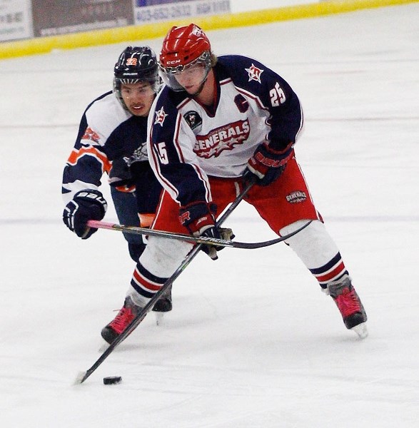 Cochrane Generals forward Chris Hugo works the puck in front of High River Flyers&#8217; Jalen Twigg in Heritage Junior Hockey League play Oct. 31 in High River. Flyers edged 