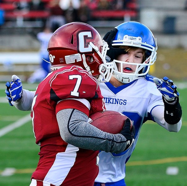 Cochrane Cobras fullback Mac Chaisson dishes out an eyeful while rumbling for yards against Medicine Hat&#8217;s Crescent Heights Vikings.