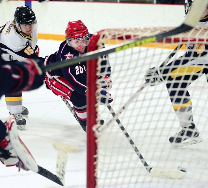 Cochrane Generals forward Colby Chartier takes the puck hard to the net as Gens took down the Stettler Lightning 6-5 in Heritage League hockey play Nov. 15.