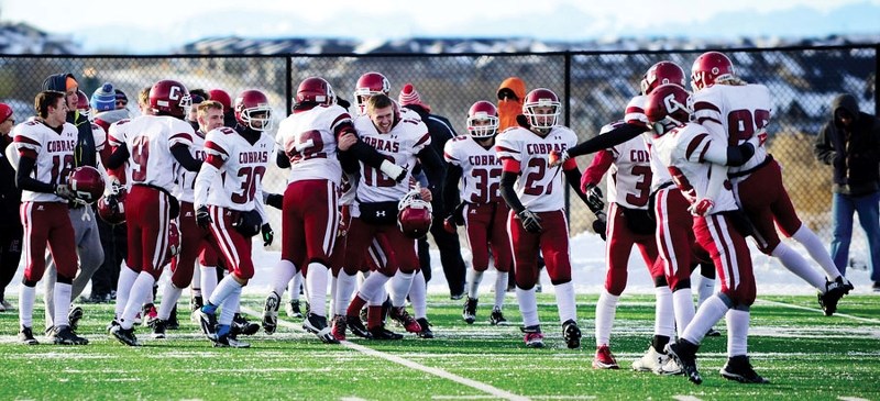 Cochrane Cobras celebrate their 36-10 win over Calgary&#8217;s Rundle College Cobras in Alberta Schools&#8217; Athletic Association South Region Tier 3 high school football