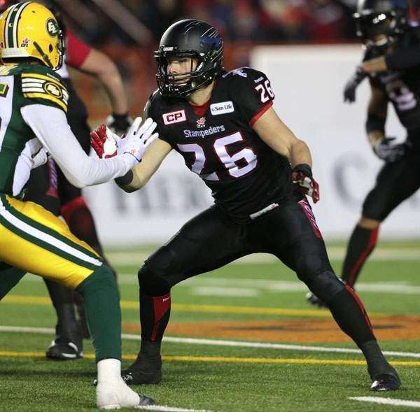 Calgary Stampeders fullback Rob Cote of Cochrane holds down the fort in Canadian Football League West Final play against Edmonton Eskimos Nov. 23 in Calgary. The Stamps
