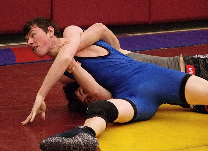 Cochrane Cowboys wrestler Luke Clubb is in control at the Wetaskiwin Classic wrestling tournament Nov. 29. Clubb, who also wrestles for St. Timothy High School Thunder, took