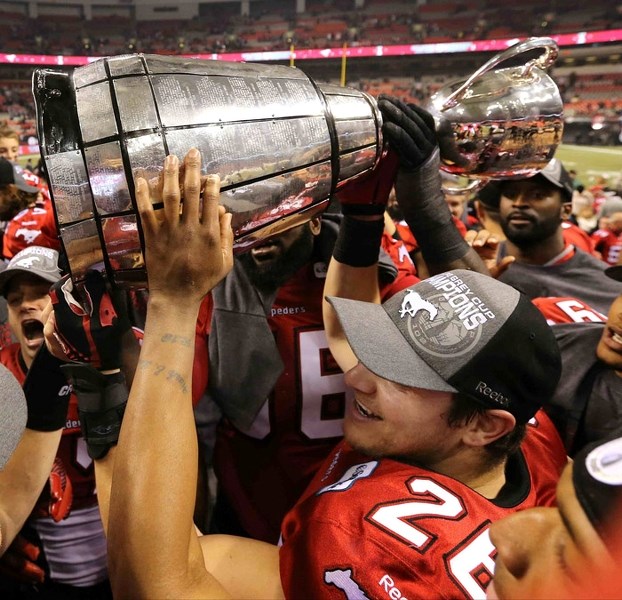 Calgary Stampeders fullback Rob Cote of Cochrane grips Canadian football&#8217;s ultimate prize after his team won the Grey Cup Nov. 30 in Vancouver.