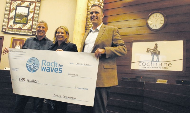 Mayor Ivan Brooker accepts a $1.35M donation to the &#8216;Rock the Waves&#8217; campaign from Patricia Phillips and Andrew Boblin of PBA Land Development.