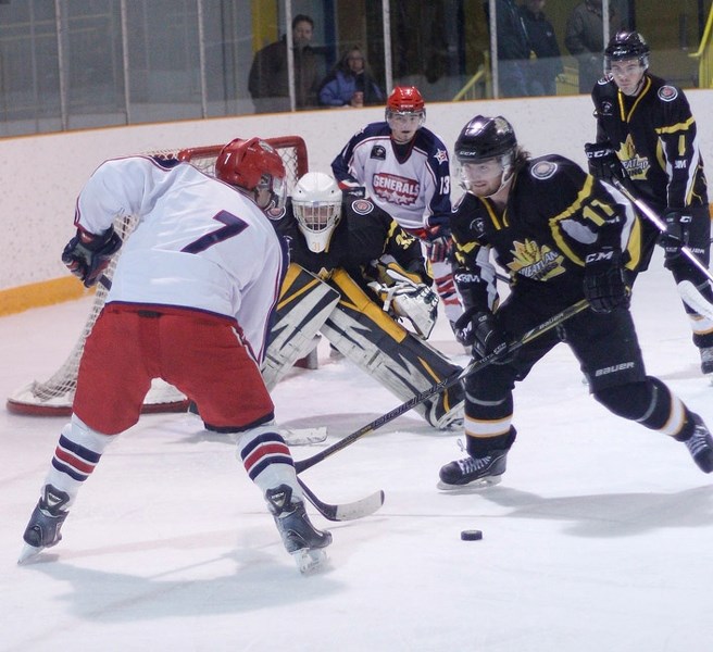 Cochrane Generals defenceman Craig Packard takes the play to Strathmore Wheatland Kings forward Keenan Ogle as Gens forward Corey Goeson lurks at the side of the Strathmore