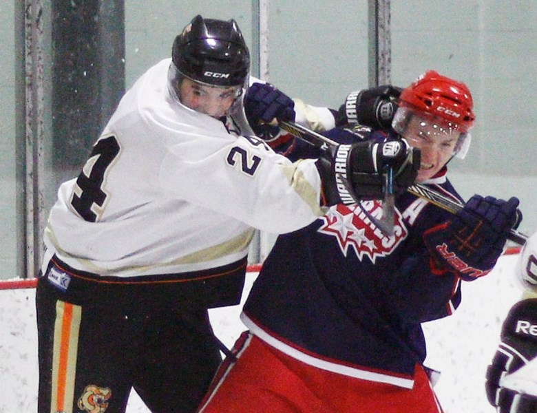 Cochrane Generals defenceman Logan Brown (above, right) gets into it behind the play with Coaldale Copperheads forward Jay Hitchcock in Heritage Junior Hockey League play