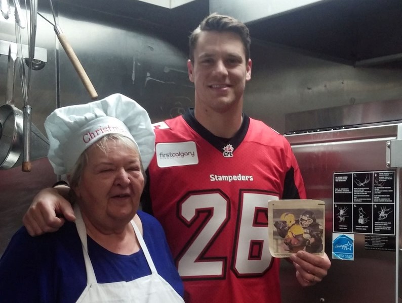 Rob Cote with Raya Evans, the chef at Prairie Smoke Country Kitchen, Dec. 23, where the restaurant and Family and Community Support Services held a Christmas dinner for those 