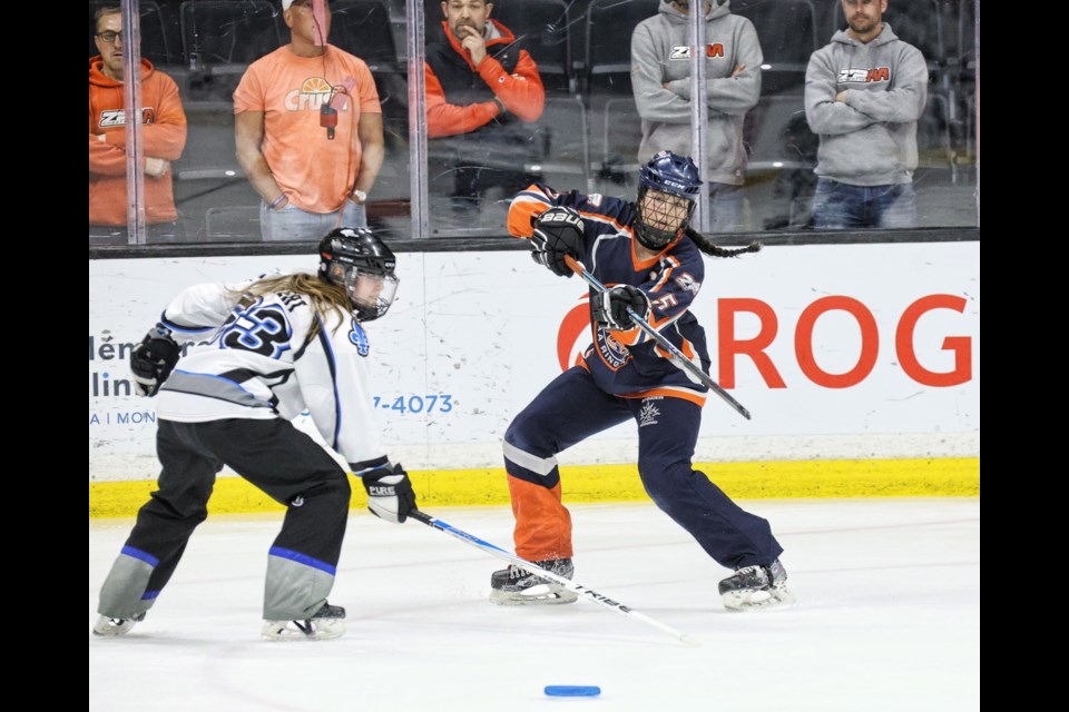 Dylan Pighin (blue and orange) at the 2025 Canadian Ringette Championships. 