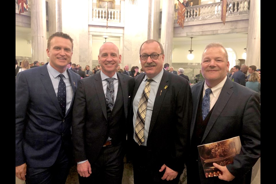 Alberta Municipal Affairs Minister Ric McIver with Airdrie-Cochrane MLA Pete Guthrie, Mayor Jeff Genung, and Airdrie Mayor Peter Brown at the Alberta Legislature on October 30 for the  Throne Speech. An online survey from Alberta Municipal Affairs — a survey that can be taken repeatedly — could affect legislation relating to local government.