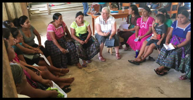 Judie Bopp, centre, of the Rotary Club of Cochrane meets with a focus group of women from three disadvantaged Maya villages in southern Belize. 