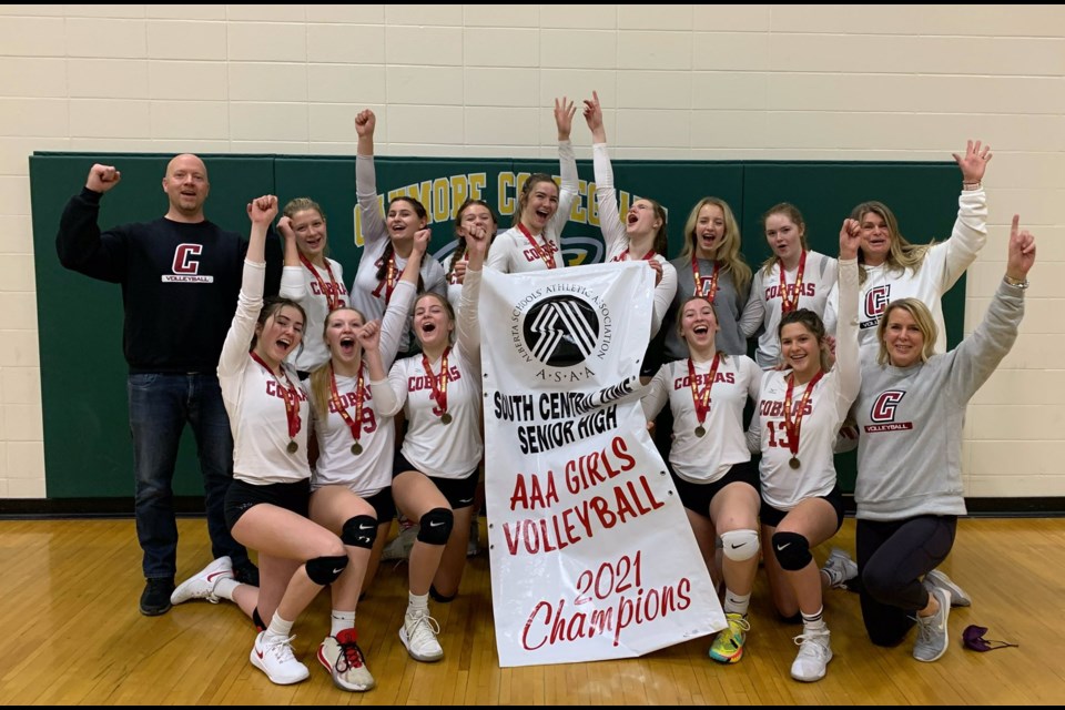 The Cobras senior girls team poses with the South Central Zone banner after winning the tournament in Strathmore Nov. 20. The team will play in the ASAA provincial volleyball championships Nov. 24-27. (Supplied Photo)