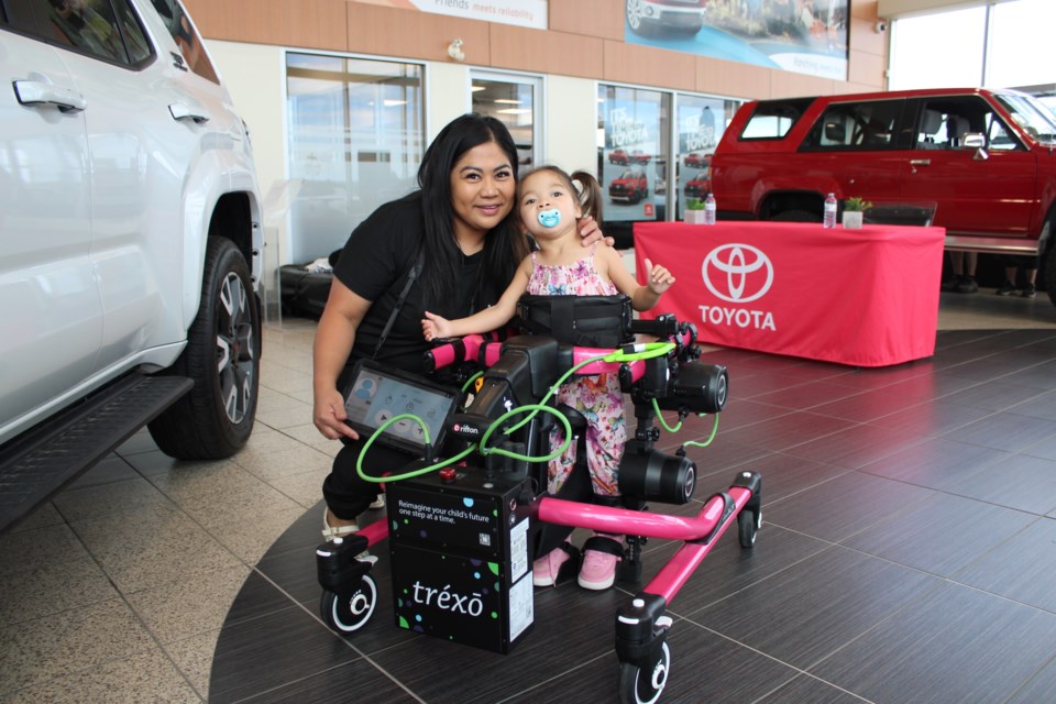 Michelle Aguilar and Brielle Thomson in her Trexo at Cochrane Toyota on August 11. 
