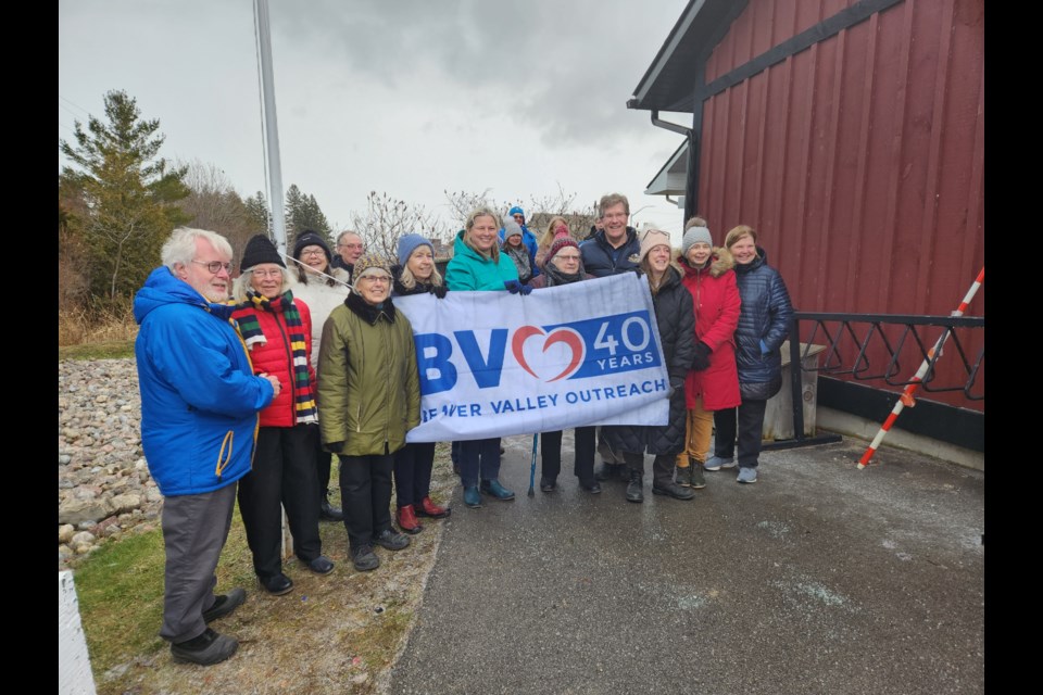 A large group gathered at the Beaver Valley Outreach in Thornbury to raise the BVO’s flag to commemorate the organization’s 40th anniversary.