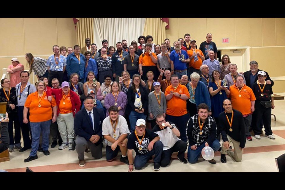 Volunteers and bowlers with the Special Olympics Collingwood and Area gather for a photo together. Debbie Gruter has been a volunteer for over two decades.
