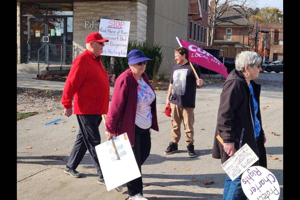 CUPE’s Grey Bruce Regional Lead Chris Juniper (holding flag) was leading striking workers in Owen Sound on November 4.