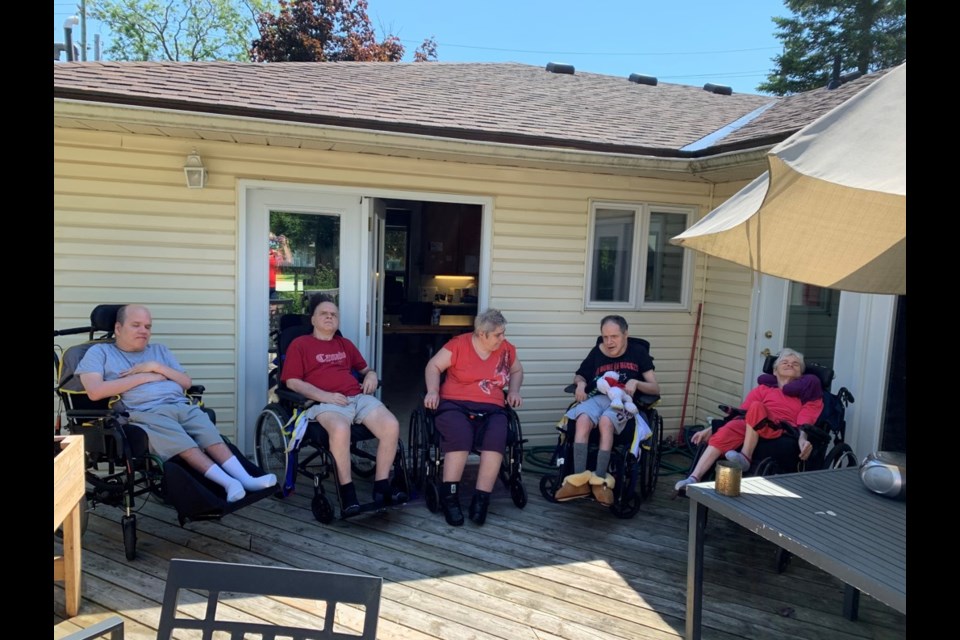 Residents at E3's group homes are leaning on each other and staff as they have been largely cut off from physical contact outside their household. Contributed photo