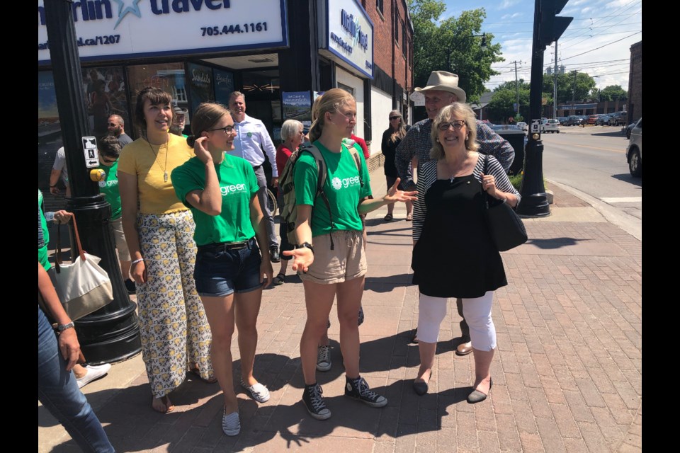 MP and Green Party leader Elizabeth May walks on Hurontario with her young guides. Erika Engel/CollingwoodToday
