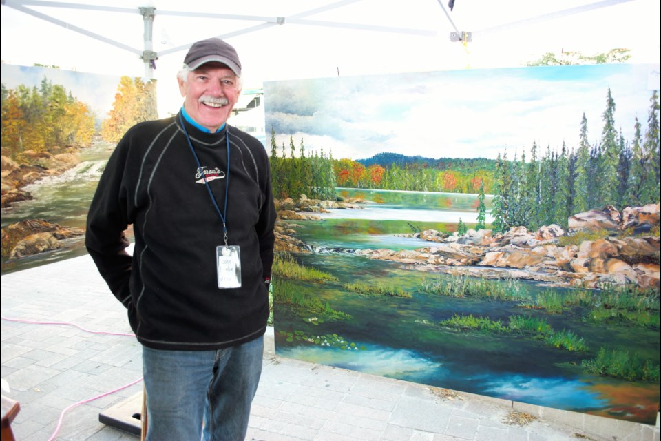 John Burton, a Collingwood artist, had a booth set up with his paintings at the Collingwood Art Crawl this year, and also participated in the Battle of the Brushes event. Jessica Owen/CollingwoodToday