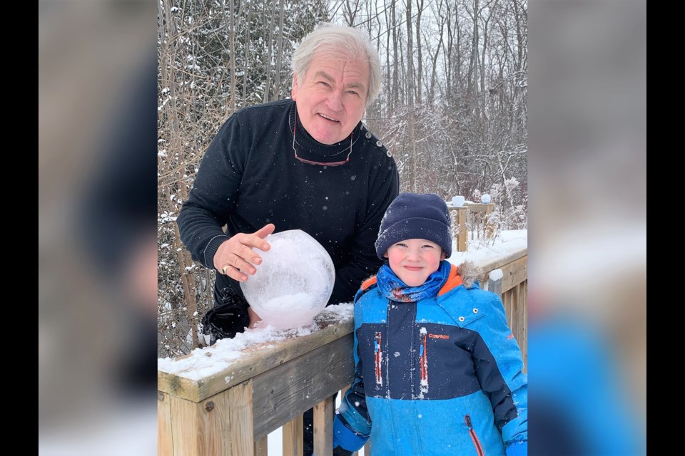 David Jefferies and his five-year-old grandson Jackson have been making ice globes together and placing them along some of Collingwood's trails.