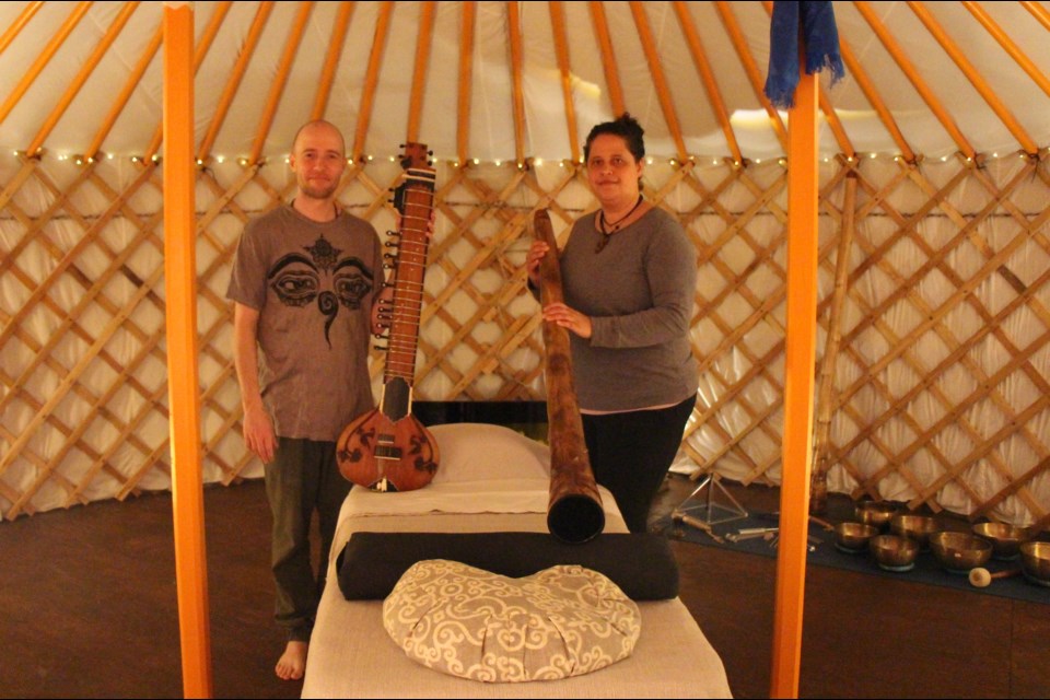 Jay Robinson and Justine Sanderson use the vibrations of music to offer relaxation and healing in their yurt. Maddie Johnson for CollingwoodToday