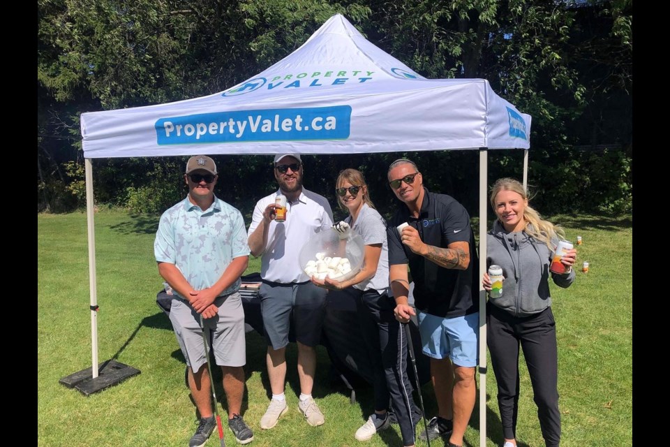 Participants in the 2022 Property Valet charity golf tournament are shown.