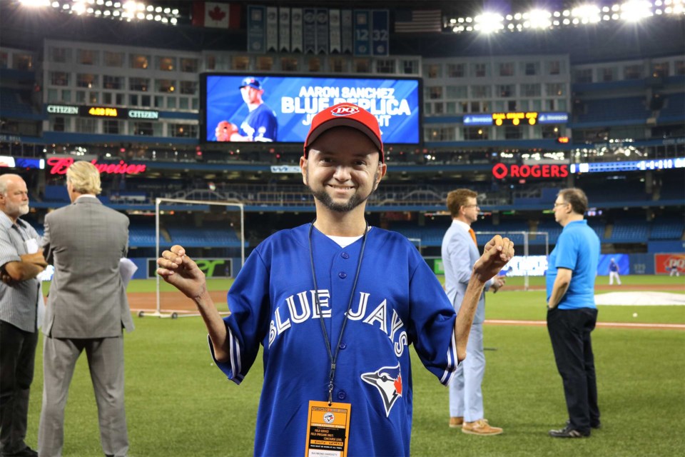 Raymond Hardisty on the field at the Blue Jays game Aug. 8. Dairy Queen Canada photo