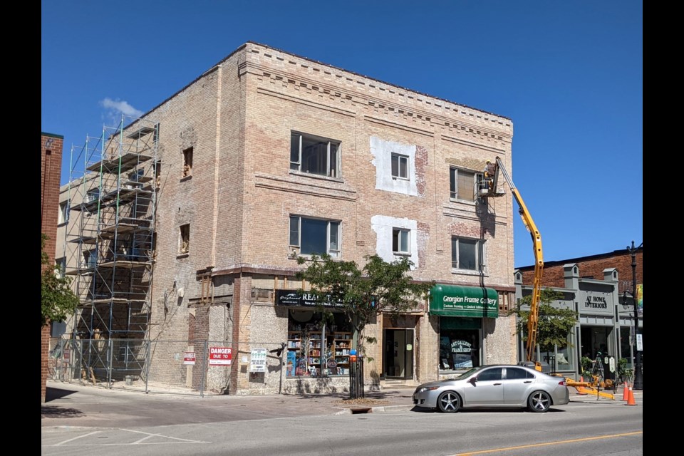 The first step of the restoration process of the former Dorchester Inn was the careful removal of the stucco-like material to bring back the building’s original brick exterior.
