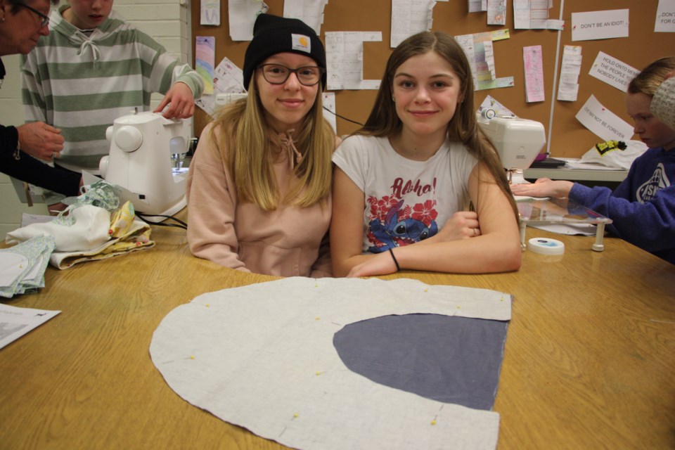 Grade 7/8 students who have taken local sewing classes volunteered to sew the pouches that had been cut out by younger students. Erika Engel/CollingwoodToday  