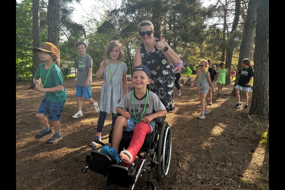 The Cameron St. school parent council's Kilometre Club in action. 
This student didn't let an injury get in their way, and joined the Kilometre Club with some wheels and assistance. 