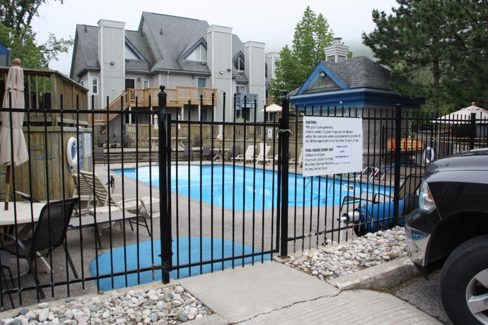 The pool where a mother and daughter died by apparent drowning last night was being drained this morning, and a sign on the gate states the pool is temporarily closed. Erika Engel/CollingwoodToday
